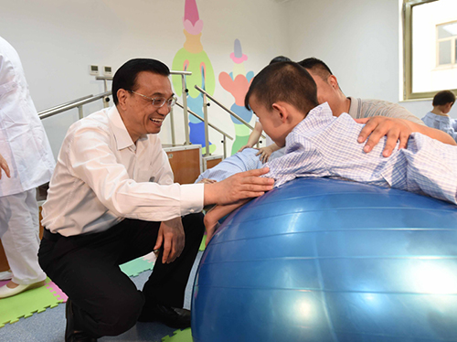 這三年，總理牽掛的殘疾人群體，迎來哪些暖政？