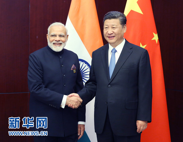 6月9日，國家主席習(xí)近平在阿斯塔納會(huì)見印度總理莫迪。 新華社記者姚大偉 攝